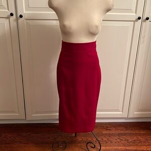 NWOT. RED MIDI SKIRT FULLY LINED. size 6. Two hidden slits on back panel.